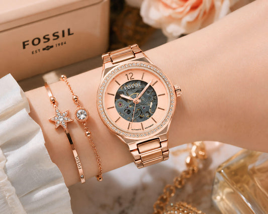Women's rose-gold skeleton automatic watch with metal link bracelet and open dial