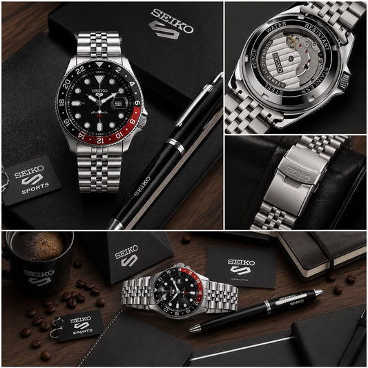 Stainless steel GMT analog watch with black dial, orange bezel, and metal bracelet