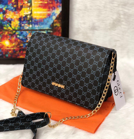 Women's monogram chain sling bag, dark/black with gold-tone chain and flap closure