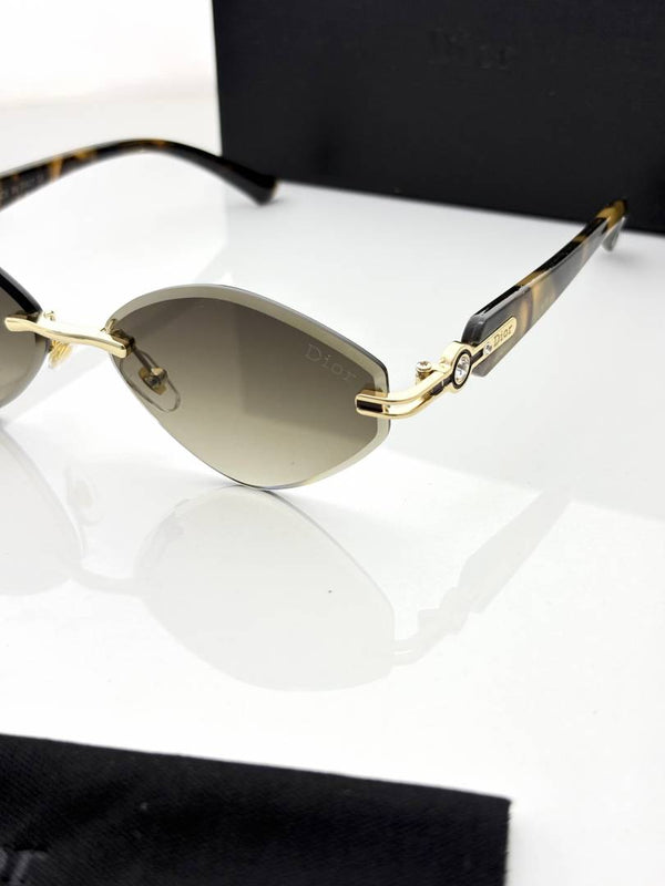 Rimless dark brown shaded sunglasses with gold metal frame and double-link temples