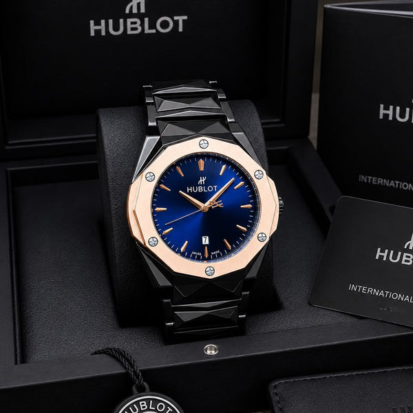 Bold black and rose gold chronograph watch for men with a deep blue dial, date display, and stainless steel bracelet.