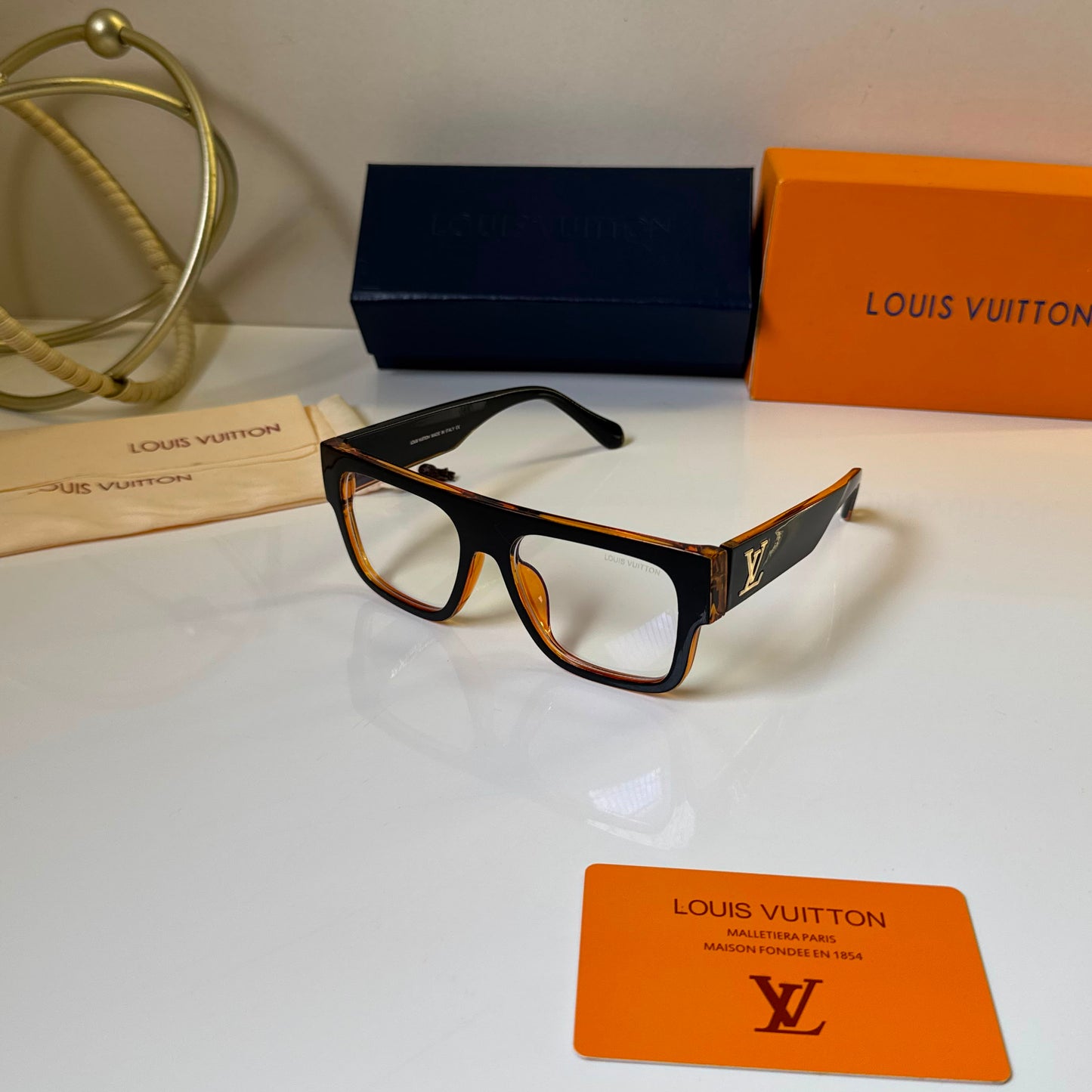 Dual tone square blue light glasses with clear lenses, lightweight unisex frame, stylish computer eyewear displayed with premium storage box and accessories.