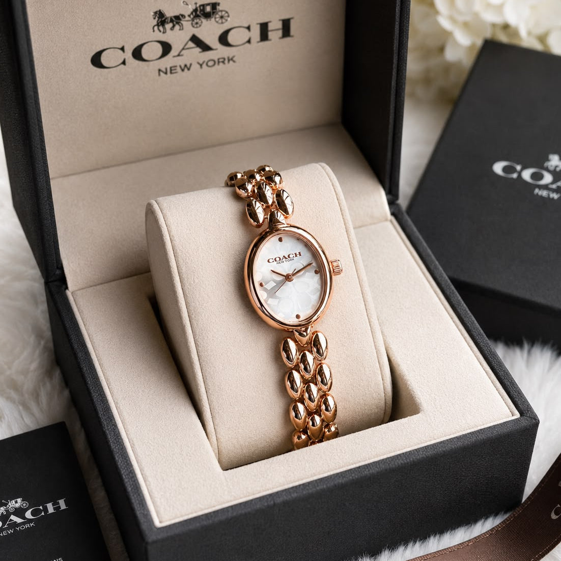 Elegant rose gold oval bracelet watch for women with a white patterned dial, jewellery-inspired stainless steel bracelet, and mineral glass.