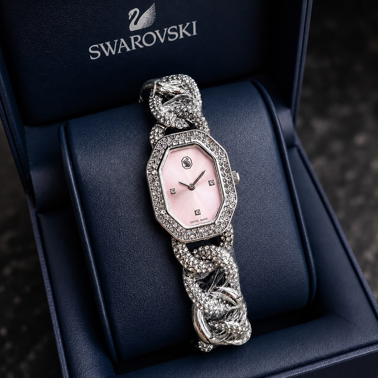 Elegant silver ladies watch with crystal-studded bracelet, pink dial, and sparkling bezel in a luxury presentation box.