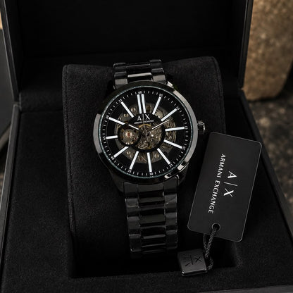 Premium black skeleton automatic watch for men with transparent dial, Japanese self-winding movement, and black stainless steel bracelet.