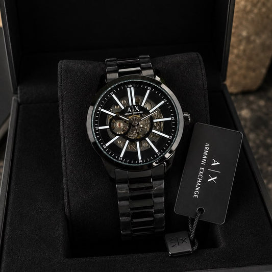 Premium black skeleton automatic watch for men with transparent dial, Japanese self-winding movement, and black stainless steel bracelet.