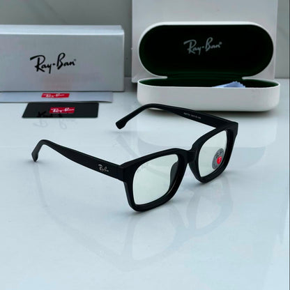 Premium matte black square blue light blocking eyeglasses with clear lenses displayed alongside protective case and accessories on a white surface.