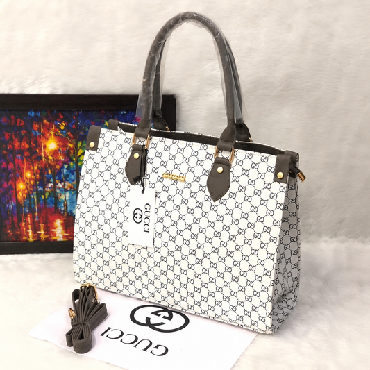 Premium women's monogram pattern tote bag with dual top handles, detachable shoulder strap, spacious design, available in white, black, beige, and brown colour options.