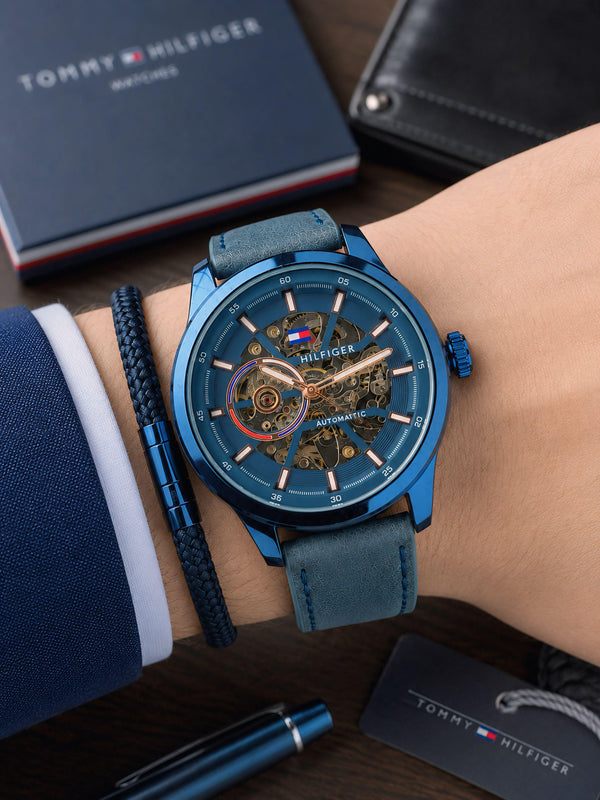 Men's automatic skeleton dial watch, blue dial with metal movement details, blue strap