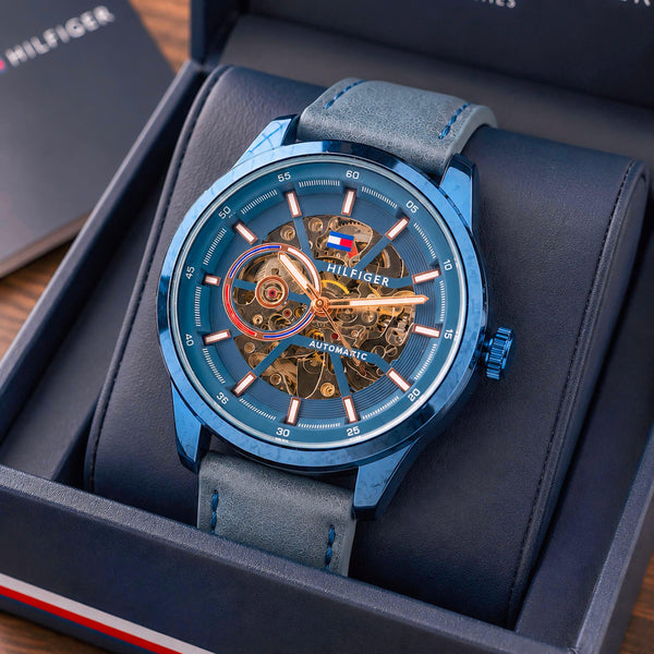 Men's automatic skeleton dial watch with blue leather strap and blue steel case