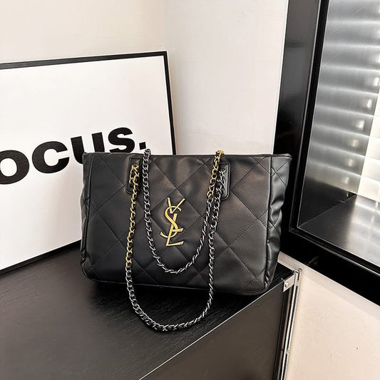 Quilted black leather-look tote with YSL logo center and linked chain handles