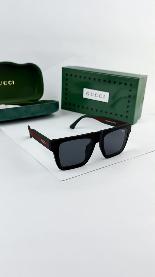 Black square sunglasses with dark lenses and green/red temple accent with Gucci
