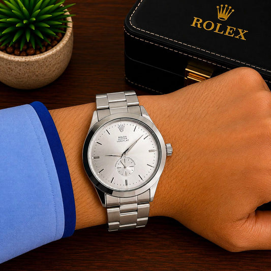 Men's Rolex stainless steel wristwatch with white dial and metal link bracelet