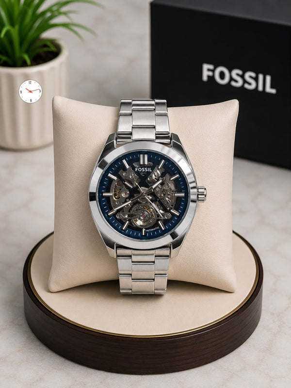 Men's automatic wristwatch with silver metal link bracelet and navy blue skeleton dial
