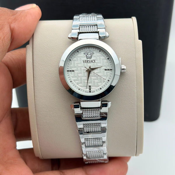 Women's analog quartz watch with silver bracelet and round silver dial.