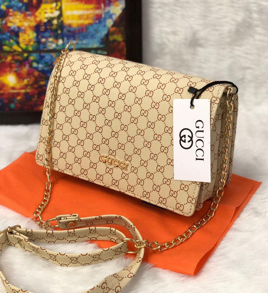Women's monogram chain sling bag, beige with gold-tone chain and magnetic flap