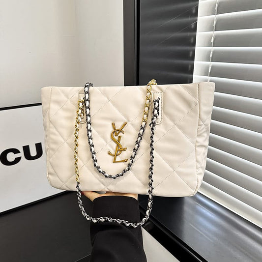 Cream quilted tote bag with gold and silver chain straps and YSL logo