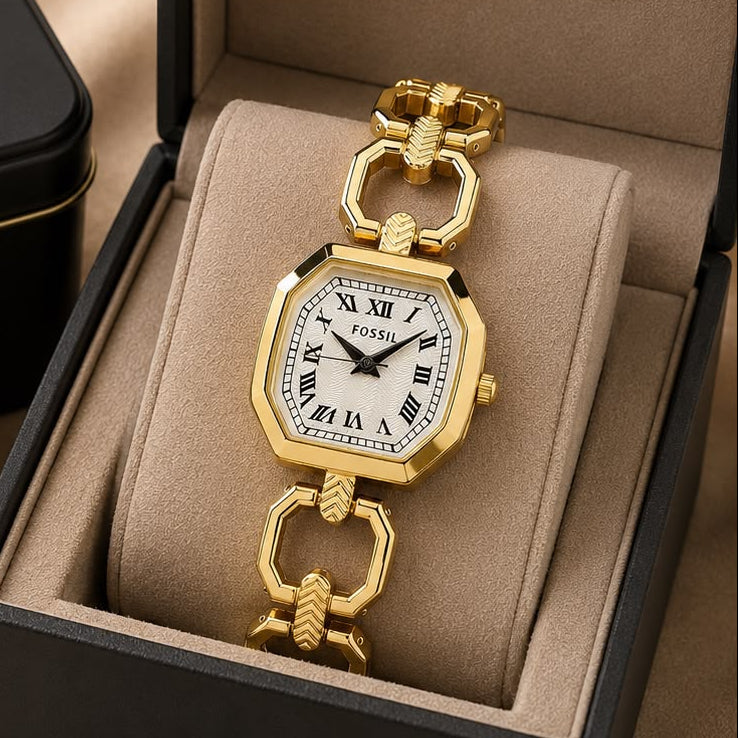 Women’s gold-tone octagonal watch with white Roman numeral dial and open-link metal bracelet
