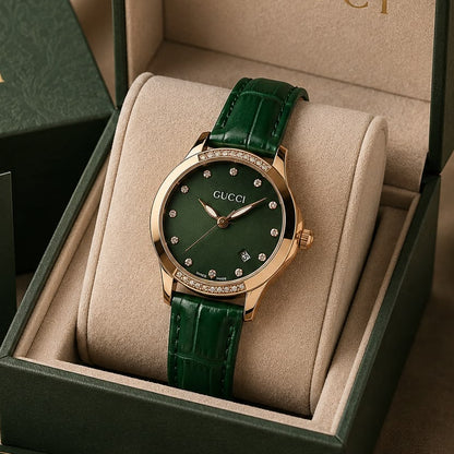 Women’s green dial rose gold-tone watch with crystal-studded bezel and textured green leather strap