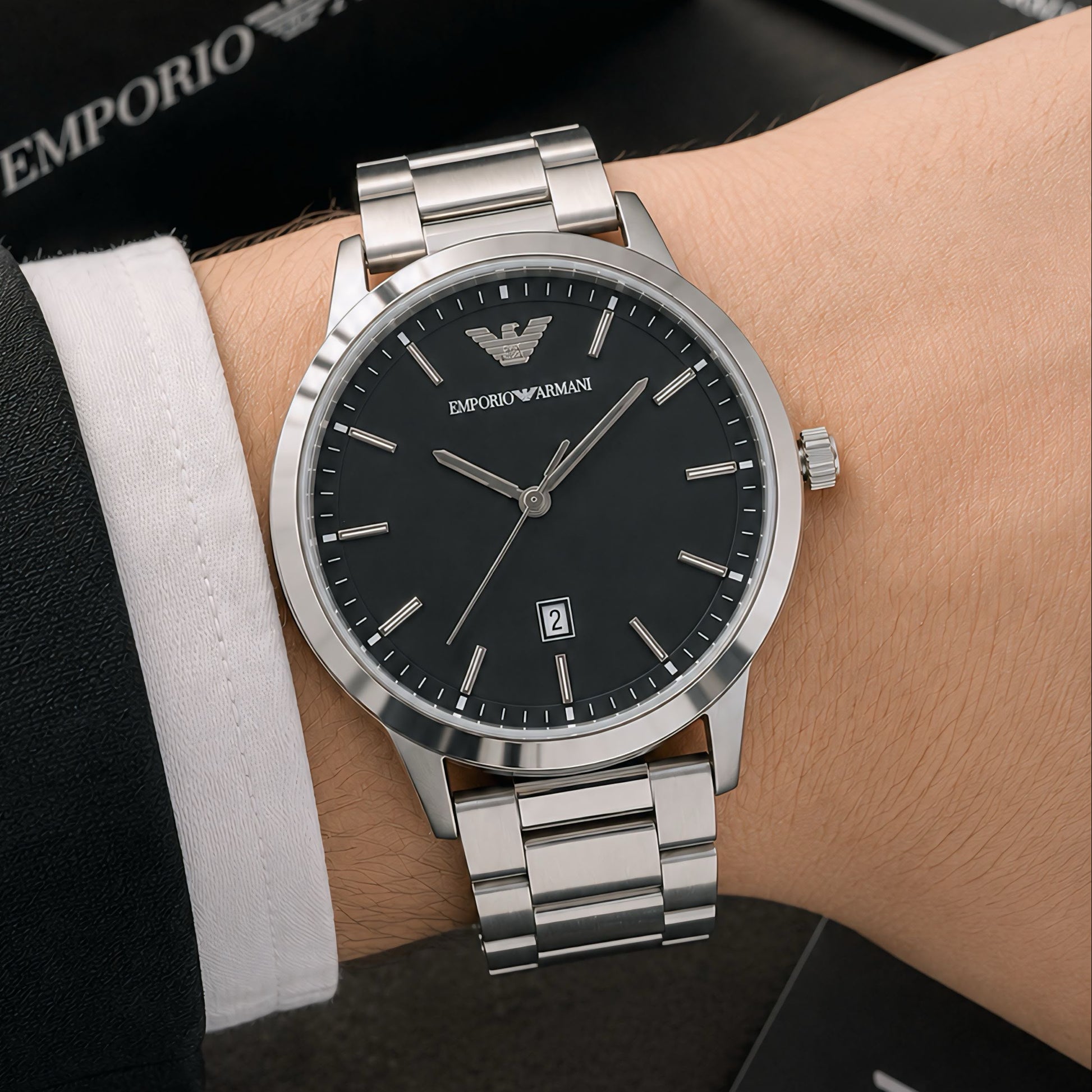 Premium stainless steel men's analog watch with a black dial, silver metal bracelet, date display, and butterfly clasp for a classic everyday look.